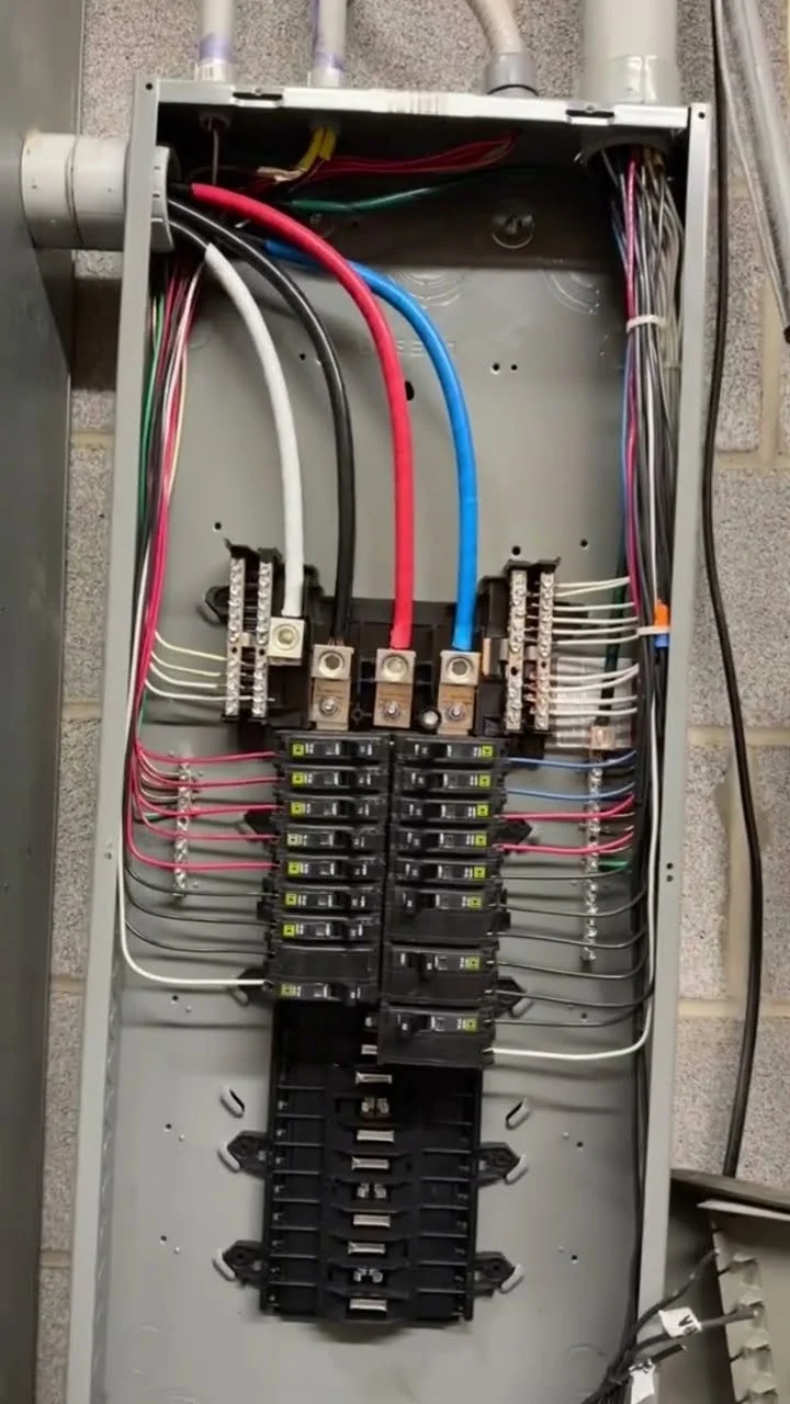 Commercial electrical panel with circuit breakers and wiring in Oceanside, CA